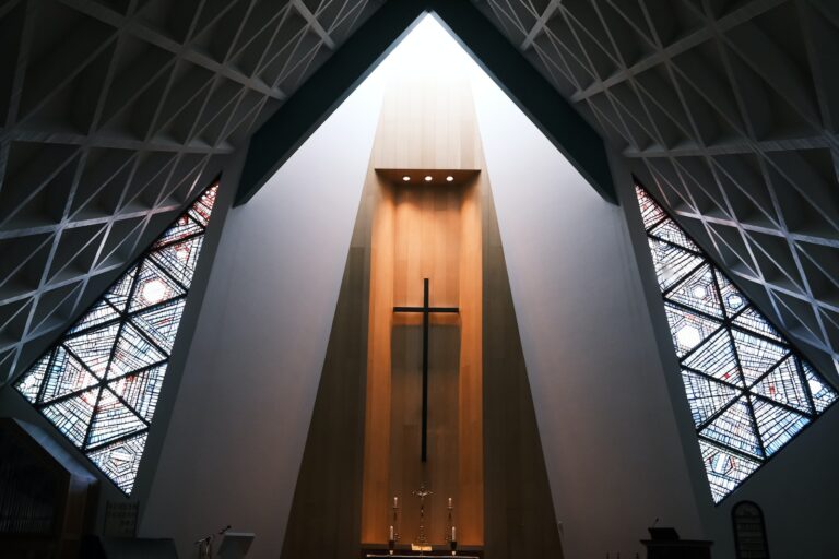 the inside of a church with stained glass windows